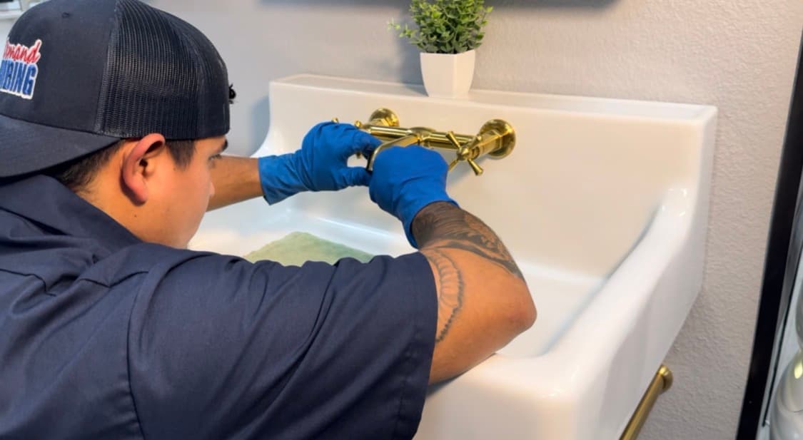 In Demand plumbing technician working inside a home