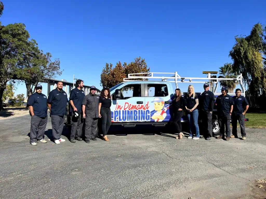 In Demand Plumbing team in front of fleet truck in Antioch.
