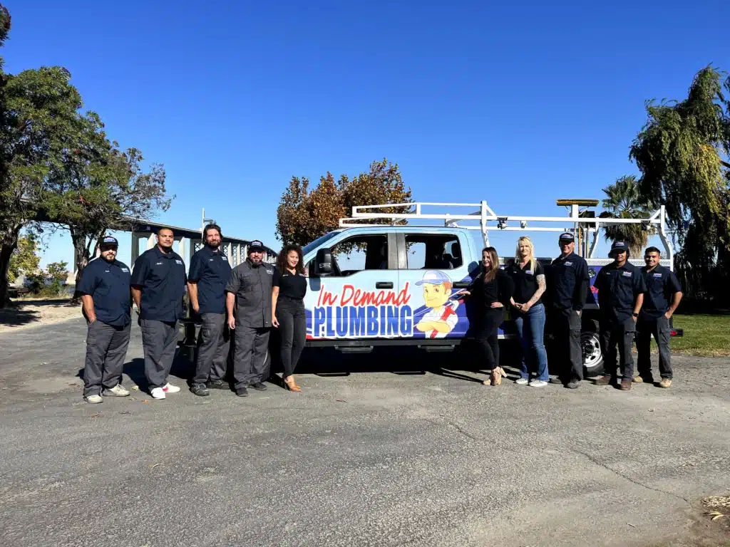 In Demand Plumbing team in front of fleet truck in Antioch.