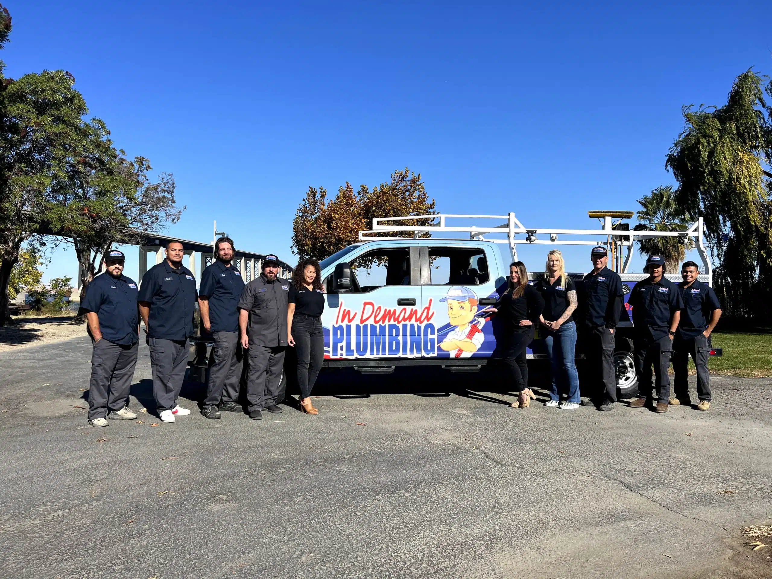In Demand Plumbing team in front of fleet truck in Antioch.