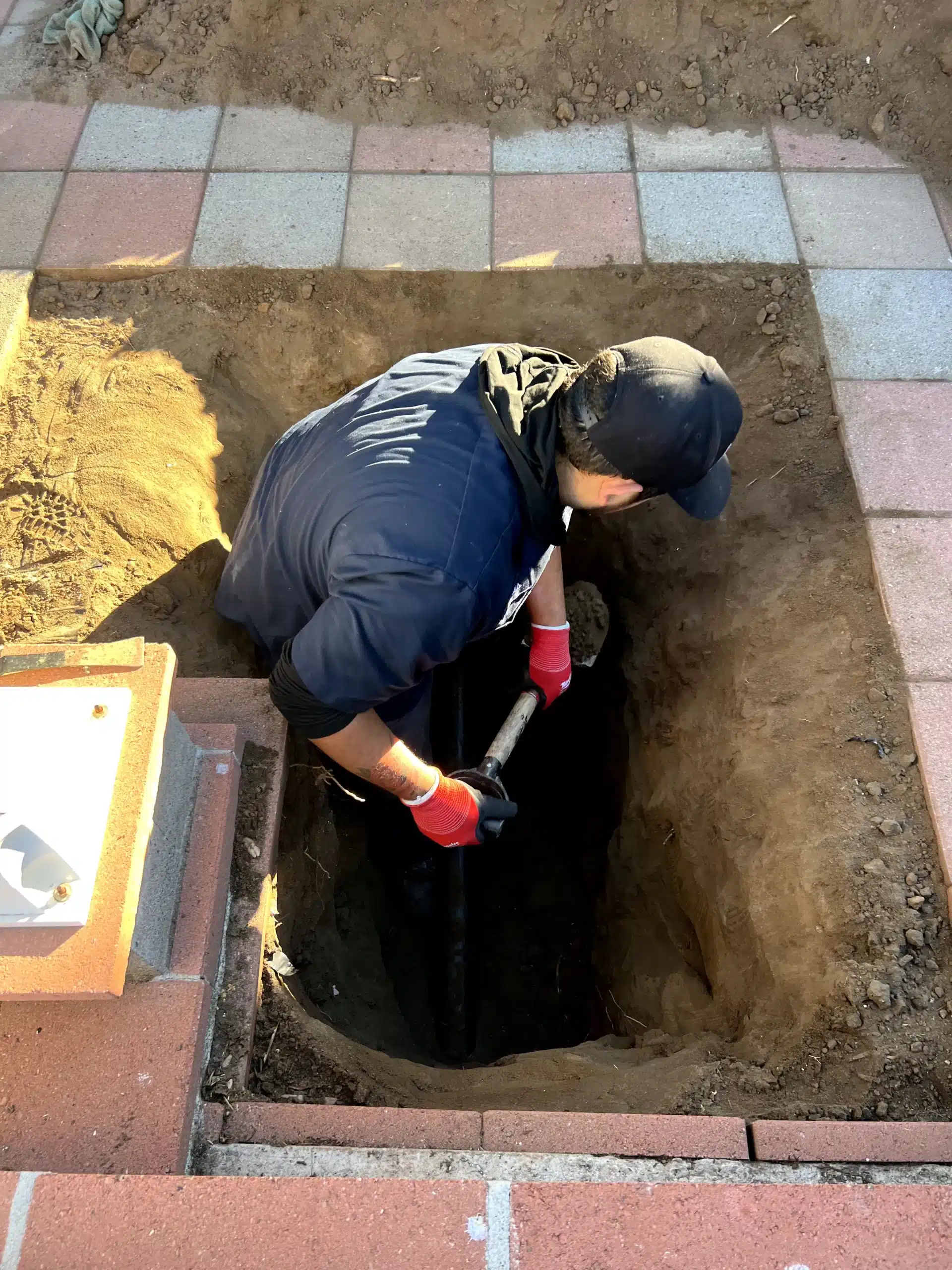 In Demand Plumbing tech repairing sewer line in Antioch.