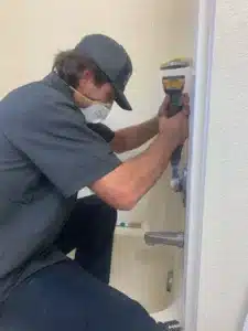 Tech installing bathtub fixtures in Antioch, CA.