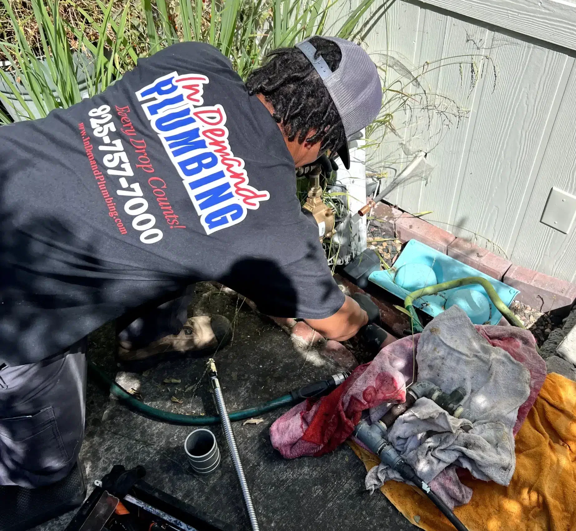 Tech installing septic line in Antioch, CA.