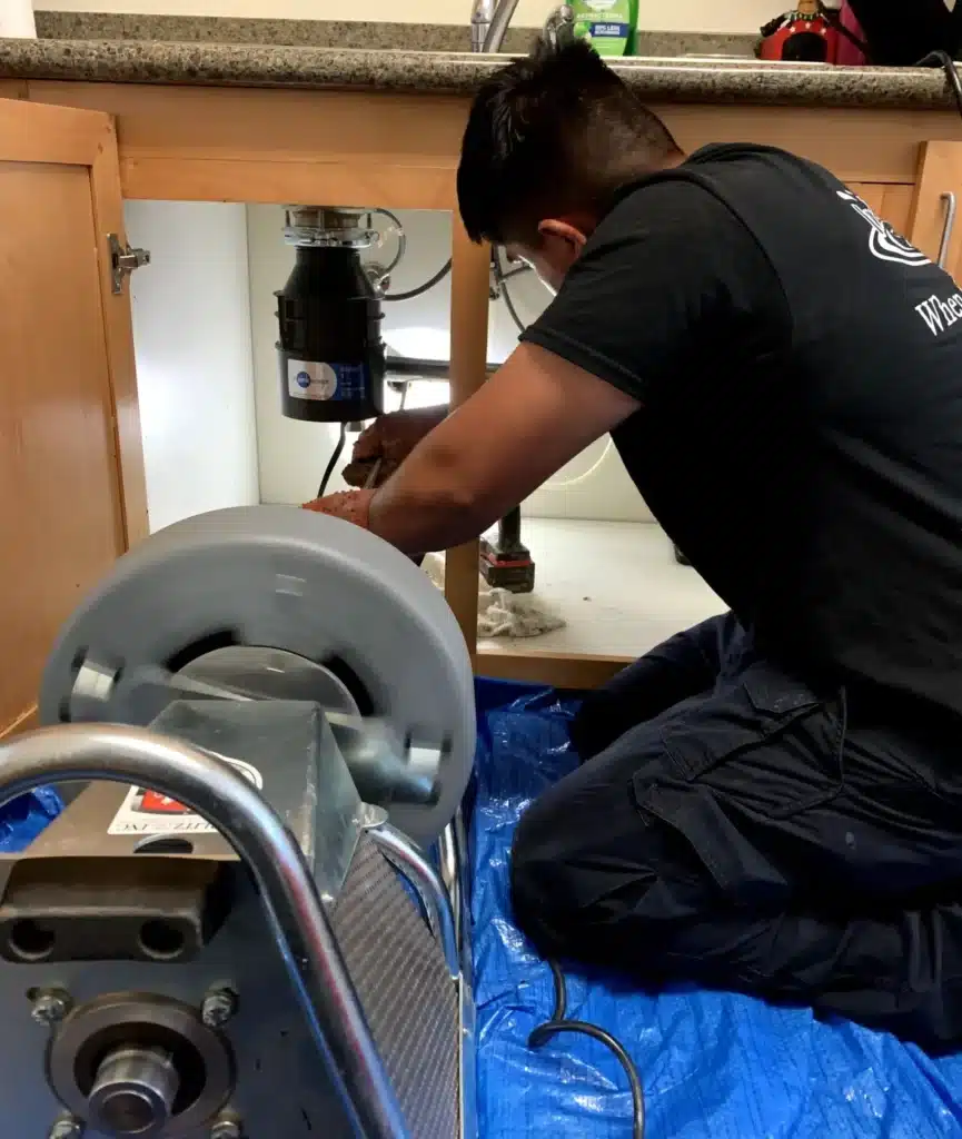 Tech repairing garbage disposal in Antioch, CA.